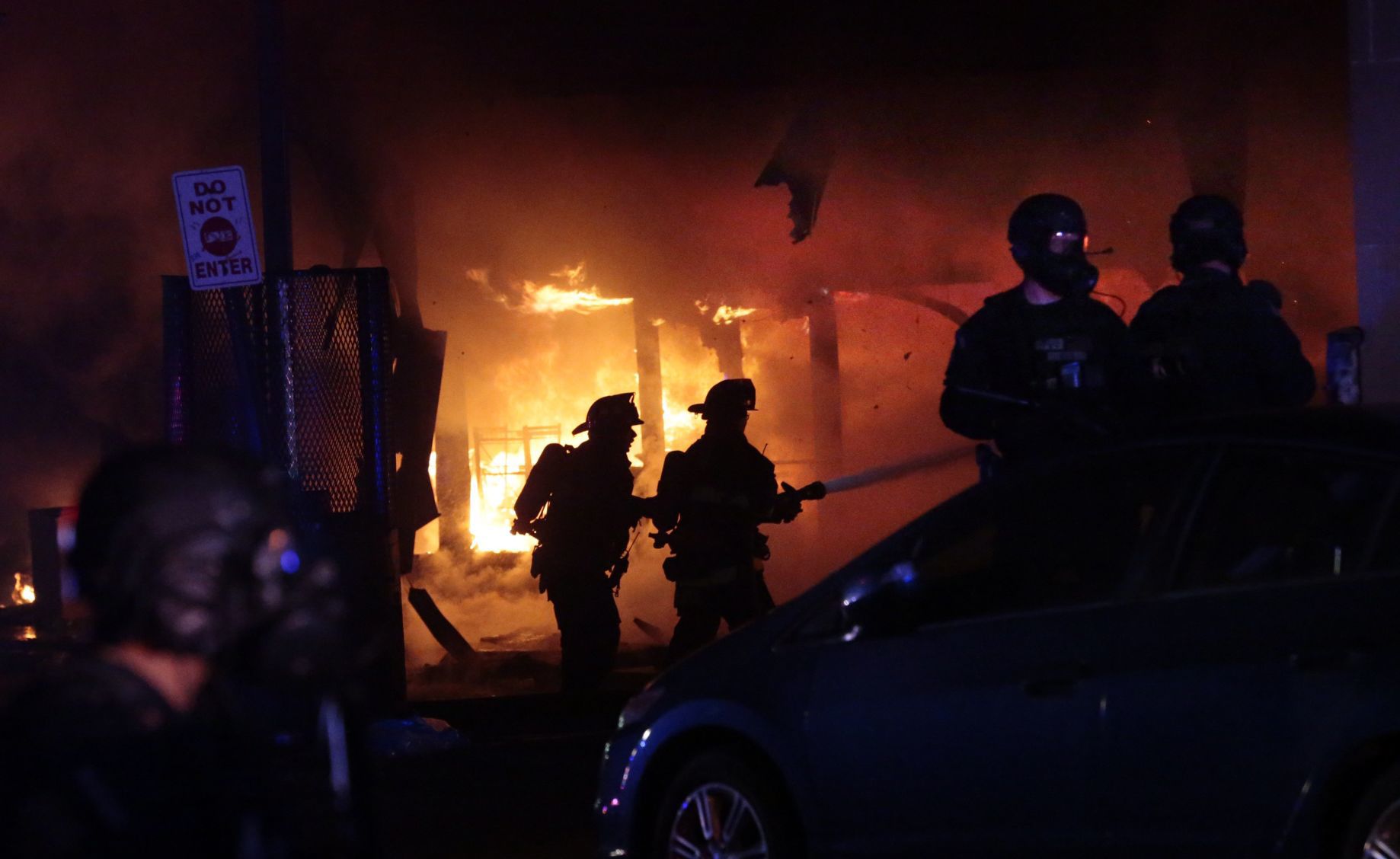 Vandals set fire to downtown 7-Eleven following protest at police station